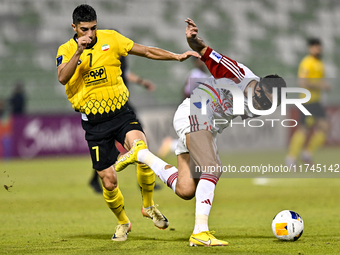 Mehdi Lamouchi of Sepahan SC battles for the ball with Khaled Ebraheim Aldhanhani of Sharjah FC during the AFC Champions League Group A foot...