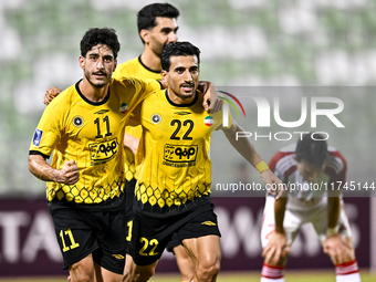 Javad Aghaeipour (L) of Sepahan SC celebrates with his teammates after scoring a goal during the AFC Champions League Group A football match...