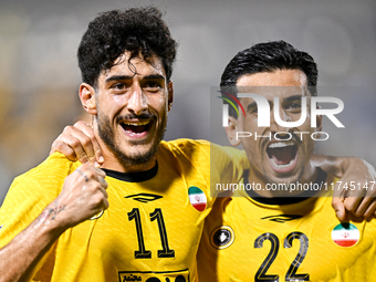 Javad Aghaeipour (L) of Sepahan SC celebrates with his teammates after scoring a goal during the AFC Champions League Group A football match...