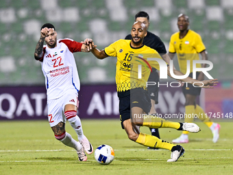 Steven Nzonzi of Asepahan SC battles for the ball with Marcus Vinicius of Sharjah FC during the AFC Champions League Two Group A football ma...