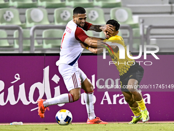 Saleh Hardani of Sepahan SC battles for the ball with Luan Pereira of Sharjah FC during the AFC Champions League Group A football match betw...