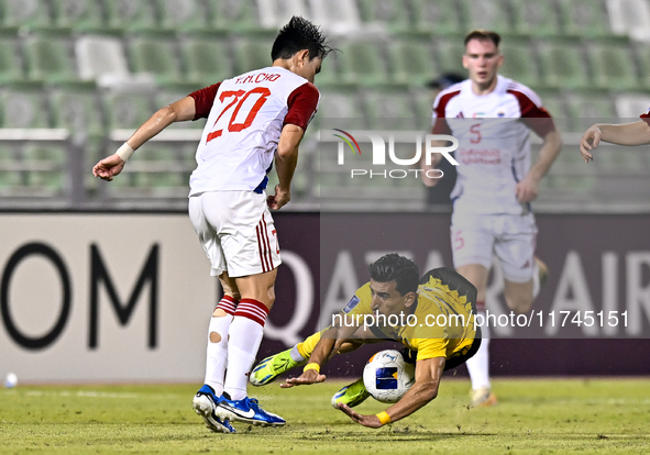 Saleh Hardani of Sepahan SC battles for the ball with Cho Yumin of Sharjah FC during the AFC Champions League Group A football match between...