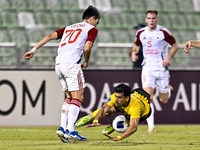 Saleh Hardani of Sepahan SC battles for the ball with Cho Yumin of Sharjah FC during the AFC Champions League Group A football match between...