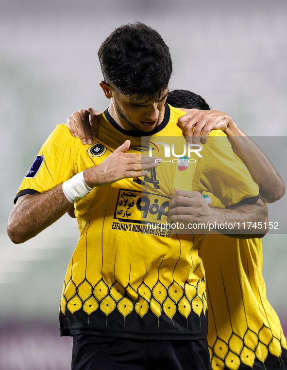 Aria Yousefi (L) of Asepahan SC celebrates with his teammates after scoring a goal during the AFC Champions League Two Group A football matc...