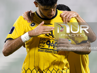 Aria Yousefi (L) of Asepahan SC celebrates with his teammates after scoring a goal during the AFC Champions League Two Group A football matc...