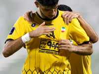 Aria Yousefi (L) of Asepahan SC celebrates with his teammates after scoring a goal during the AFC Champions League Two Group A football matc...