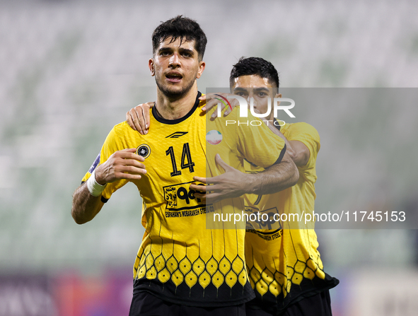 Aria Yousefi (L) of Asepahan SC celebrates with his teammates after scoring a goal during the AFC Champions League Two Group A football matc...