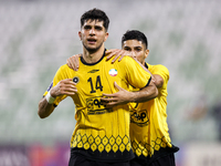 Aria Yousefi (L) of Asepahan SC celebrates with his teammates after scoring a goal during the AFC Champions League Two Group A football matc...