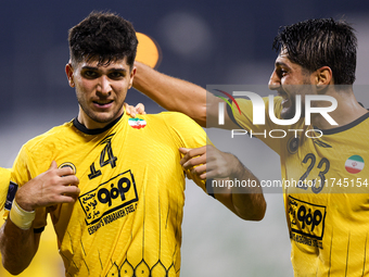 Aria Yousefi (L) of Asepahan SC celebrates with his teammates after scoring a goal during the AFC Champions League Two Group A football matc...