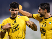 Aria Yousefi (L) of Asepahan SC celebrates with his teammates after scoring a goal during the AFC Champions League Two Group A football matc...