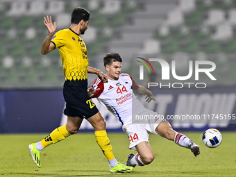 Mehdi Mohebi of Asepahan SC battles for the ball with David Petrovic of Sharjah FC during the AFC Champions League Two Group A football matc...