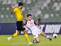 Mehdi Mohebi of Asepahan SC battles for the ball with David Petrovic of Sharjah FC during the AFC Champions League Two Group A football matc...