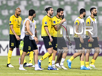 Players of Sepahan SC celebrate after winning the AFC Champions League Group A football match between United Arab Emirates' Sharjah FC and I...