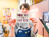 On November 5, 2024, in Minneapolis, Minnesota, Elysa Voshell, Executive Director of the Minnesota Center for Book Arts, holds a postcard pr...