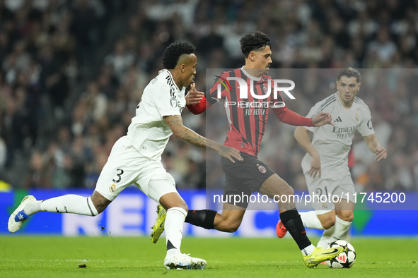 Tijjani Reijnders central midfield of AC Milan and Netherlands and Eder Militao centre-back of Real Madrid and Brazil compete for the ball d...