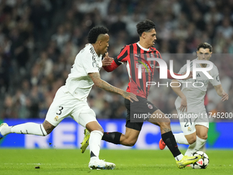 Tijjani Reijnders central midfield of AC Milan and Netherlands and Eder Militao centre-back of Real Madrid and Brazil compete for the ball d...