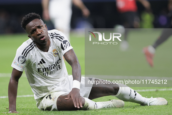 Vinicius Jr of Real Madrid reacts to a missed opportunity during the UEFA Champions League 2024/25 match between Real Madrid and AC Milan at...