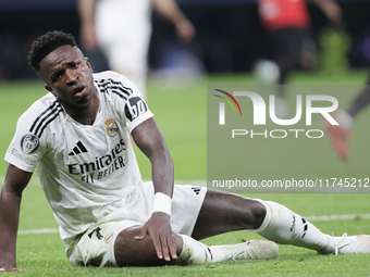 Vinicius Jr of Real Madrid reacts to a missed opportunity during the UEFA Champions League 2024/25 match between Real Madrid and AC Milan at...