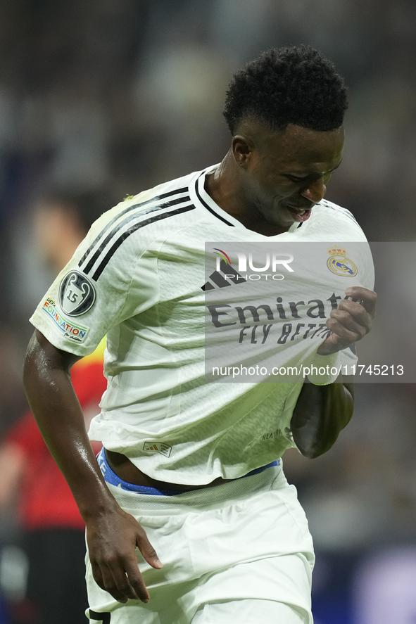 Vinicius Junior left winger of Real Madrid and Brazil celebrates after scoring his sides first goal during the UEFA Champions League 2024/25...