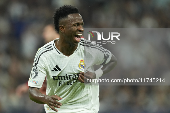 Vinicius Junior left winger of Real Madrid and Brazil celebrates after scoring his sides first goal during the UEFA Champions League 2024/25...