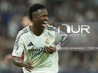 Vinicius Junior left winger of Real Madrid and Brazil celebrates after scoring his sides first goal during the UEFA Champions League 2024/25...