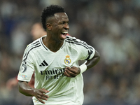 Vinicius Junior left winger of Real Madrid and Brazil celebrates after scoring his sides first goal during the UEFA Champions League 2024/25...