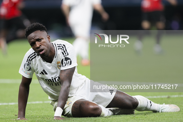 Vinicius Jr of Real Madrid reacts to a missed opportunity during the UEFA Champions League 2024/25 match between Real Madrid and AC Milan at...