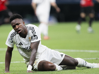 Vinicius Jr of Real Madrid reacts to a missed opportunity during the UEFA Champions League 2024/25 match between Real Madrid and AC Milan at...