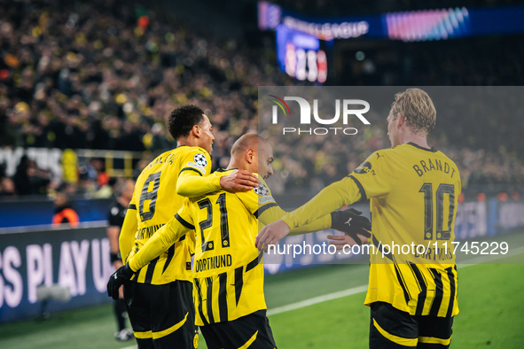 Donyell Malen of Borussia Dortmund celebrates his goal with Julian Brandt and Felix Nmecha during the UEFA Champions League 2024/25 League P...