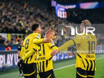 Donyell Malen of Borussia Dortmund celebrates his goal with Julian Brandt and Felix Nmecha during the UEFA Champions League 2024/25 League P...