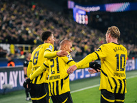 Donyell Malen of Borussia Dortmund celebrates his goal with Julian Brandt and Felix Nmecha during the UEFA Champions League 2024/25 League P...