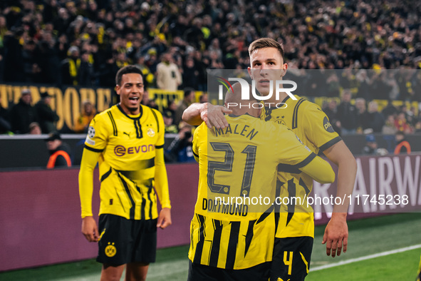 Donyell Malen of Borussia Dortmund celebrates his goal with Nico Schlotterbeck during the UEFA Champions League 2024/25 League Phase MD4 soc...