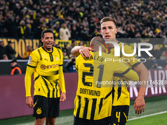 Donyell Malen of Borussia Dortmund celebrates his goal with Nico Schlotterbeck during the UEFA Champions League 2024/25 League Phase MD4 soc...