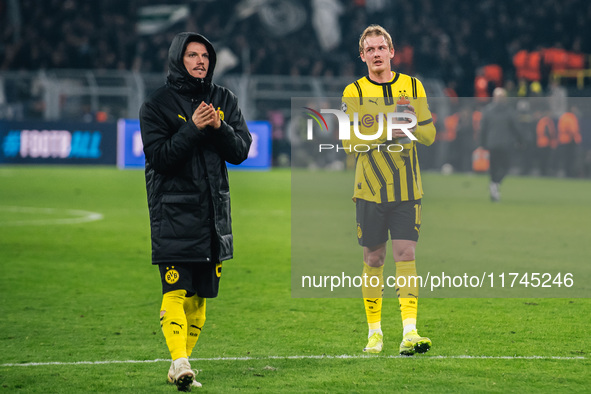 Julian Brandt and Marcel Sabitzer of Borussia Dortmund greet fans after winning the UEFA Champions League 2024/25 League Phase MD4 soccer ma...