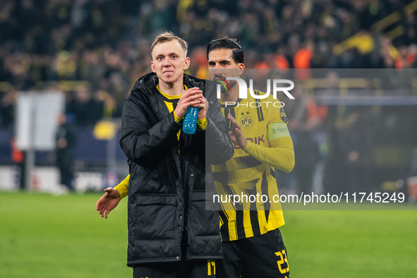 Emre Can and Maximilian Beier of Borussia Dortmund greet fans after winning the UEFA Champions League 2024/25 League Phase MD4 soccer match...