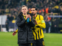 Emre Can and Maximilian Beier of Borussia Dortmund greet fans after winning the UEFA Champions League 2024/25 League Phase MD4 soccer match...