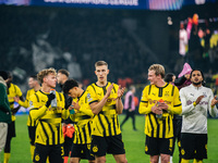 Cole Campbell, Nico Schlotterbeck, and Julian Brandt of Borussia Dortmund greet fans after winning the UEFA Champions League 2024/25 League...