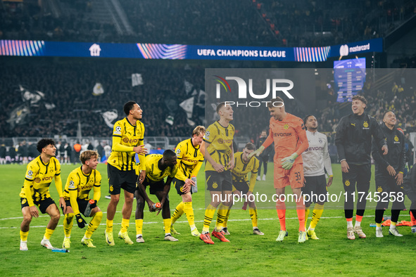 Players of Borussia Dortmund celebrate with fans after they win the UEFA Champions League 2024/25 League Phase MD4 soccer match between Boru...