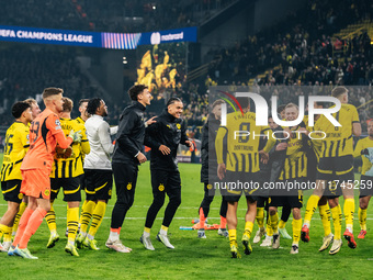 Players of Borussia Dortmund celebrate with fans after they win the UEFA Champions League 2024/25 League Phase MD4 soccer match between Boru...