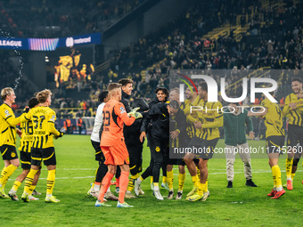 Players of Borussia Dortmund celebrate with fans after they win the UEFA Champions League 2024/25 League Phase MD4 soccer match between Boru...