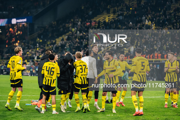 Players of Borussia Dortmund celebrate with fans after they win the UEFA Champions League 2024/25 League Phase MD4 soccer match between Boru...