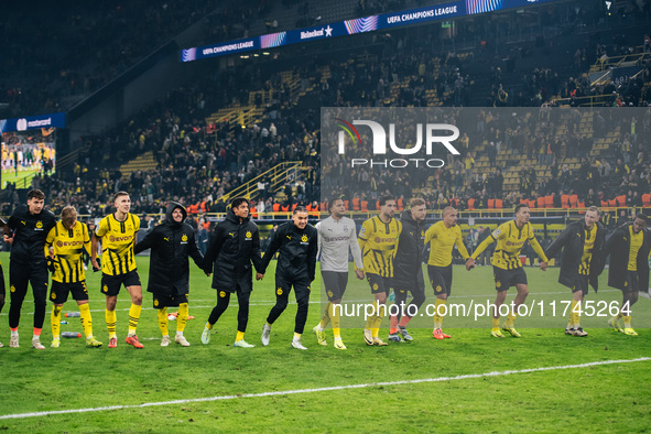 Players of Borussia Dortmund celebrate with fans after they win the UEFA Champions League 2024/25 League Phase MD4 soccer match between Boru...