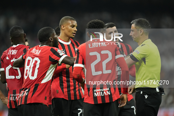 Milan's players protest to referee during the UEFA Champions League 2024/25 League Phase MD4 match between Real Madrid C.F. and AC Milan at...