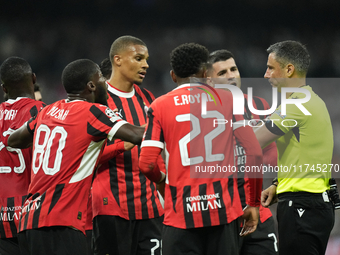 Milan's players protest to referee during the UEFA Champions League 2024/25 League Phase MD4 match between Real Madrid C.F. and AC Milan at...