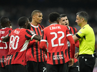 Milan's players protest to referee during the UEFA Champions League 2024/25 League Phase MD4 match between Real Madrid C.F. and AC Milan at...