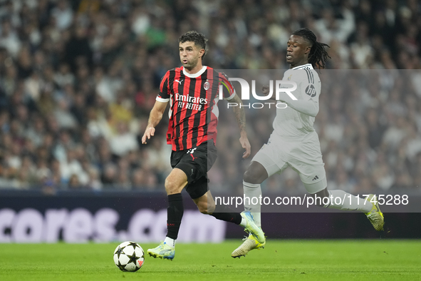 Christian Pulisic right winger of AC Milan and United States and Eduardo Camavinga central midfield of Real Madrid and France compete for th...