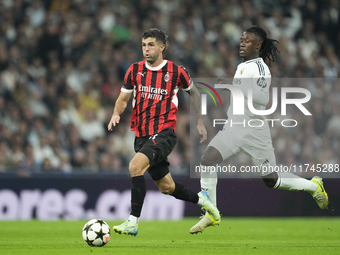 Christian Pulisic right winger of AC Milan and United States and Eduardo Camavinga central midfield of Real Madrid and France compete for th...