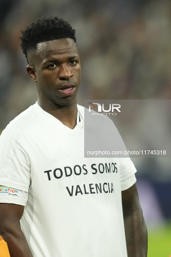 Vinicius Junior left winger of Real Madrid and Brazil with the t-shirt in support of the victims of the floods in Valencia prior the UEFA Ch...