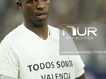 Vinicius Junior left winger of Real Madrid and Brazil with the t-shirt in support of the victims of the floods in Valencia prior the UEFA Ch...