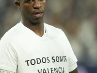 Vinicius Junior left winger of Real Madrid and Brazil with the t-shirt in support of the victims of the floods in Valencia prior the UEFA Ch...